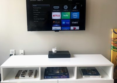 55' TV Wall Mounted with Fixed Bracket and cords concealed inside the wall