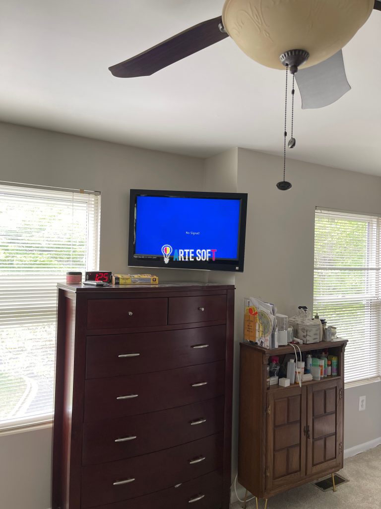 tv mounting on a corner with cords inside wall
