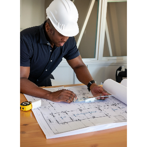 Electrician drawing blueprints for an electrical project